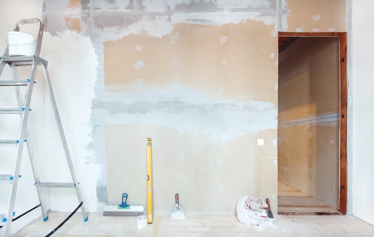 Room with patched walls ready for painting