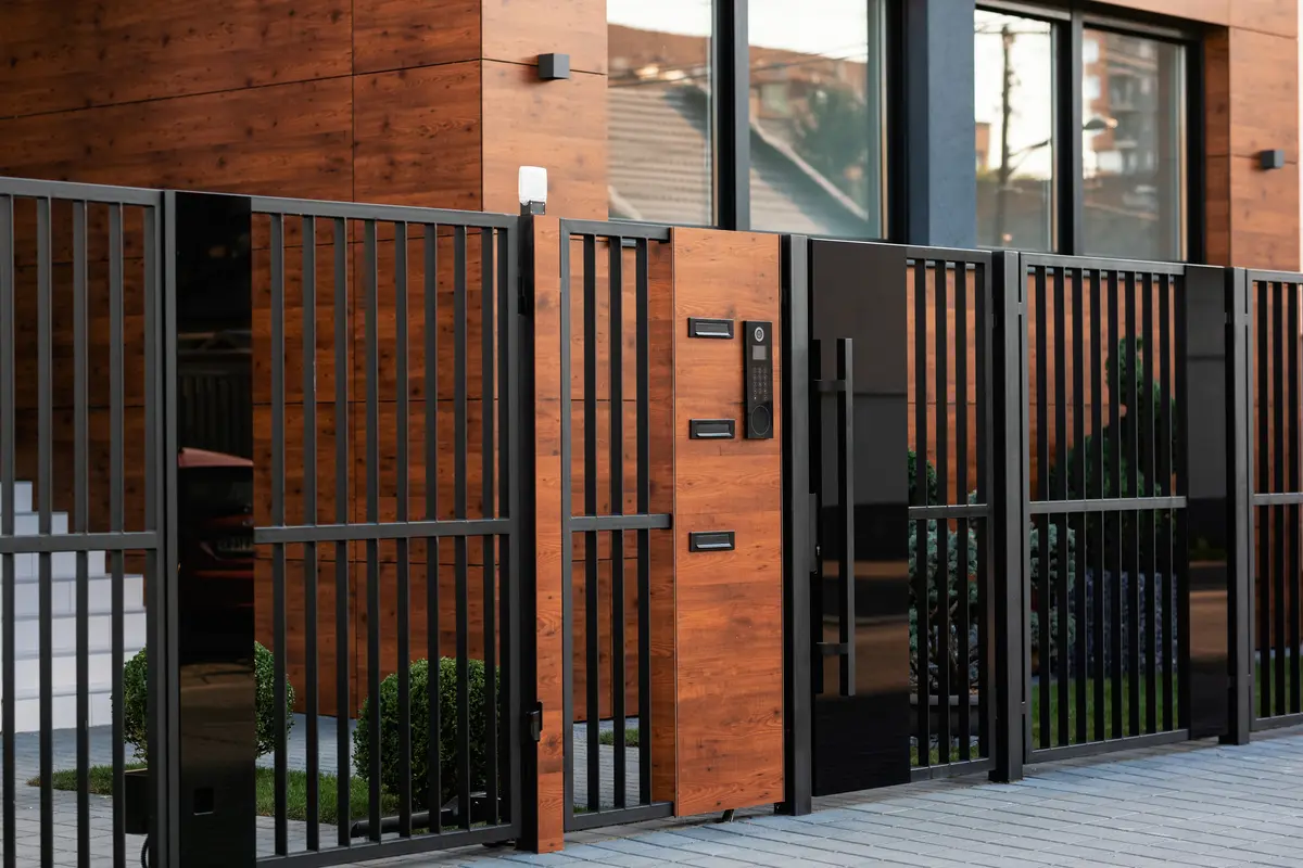 Modern home with a black metal fence and gate